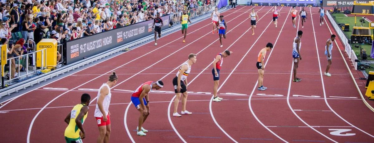 Female athletes running on track